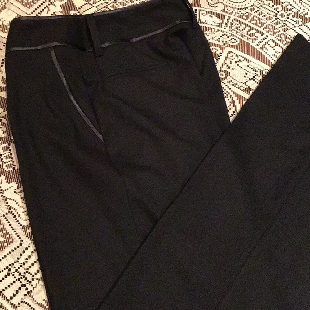 Black pants with piping along waist & side pockets